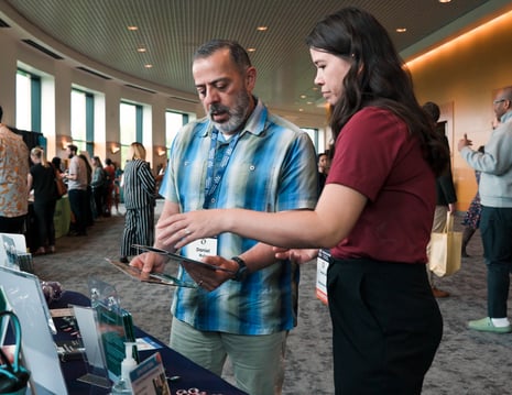 Relay accessibility staff speaking with an event attendee