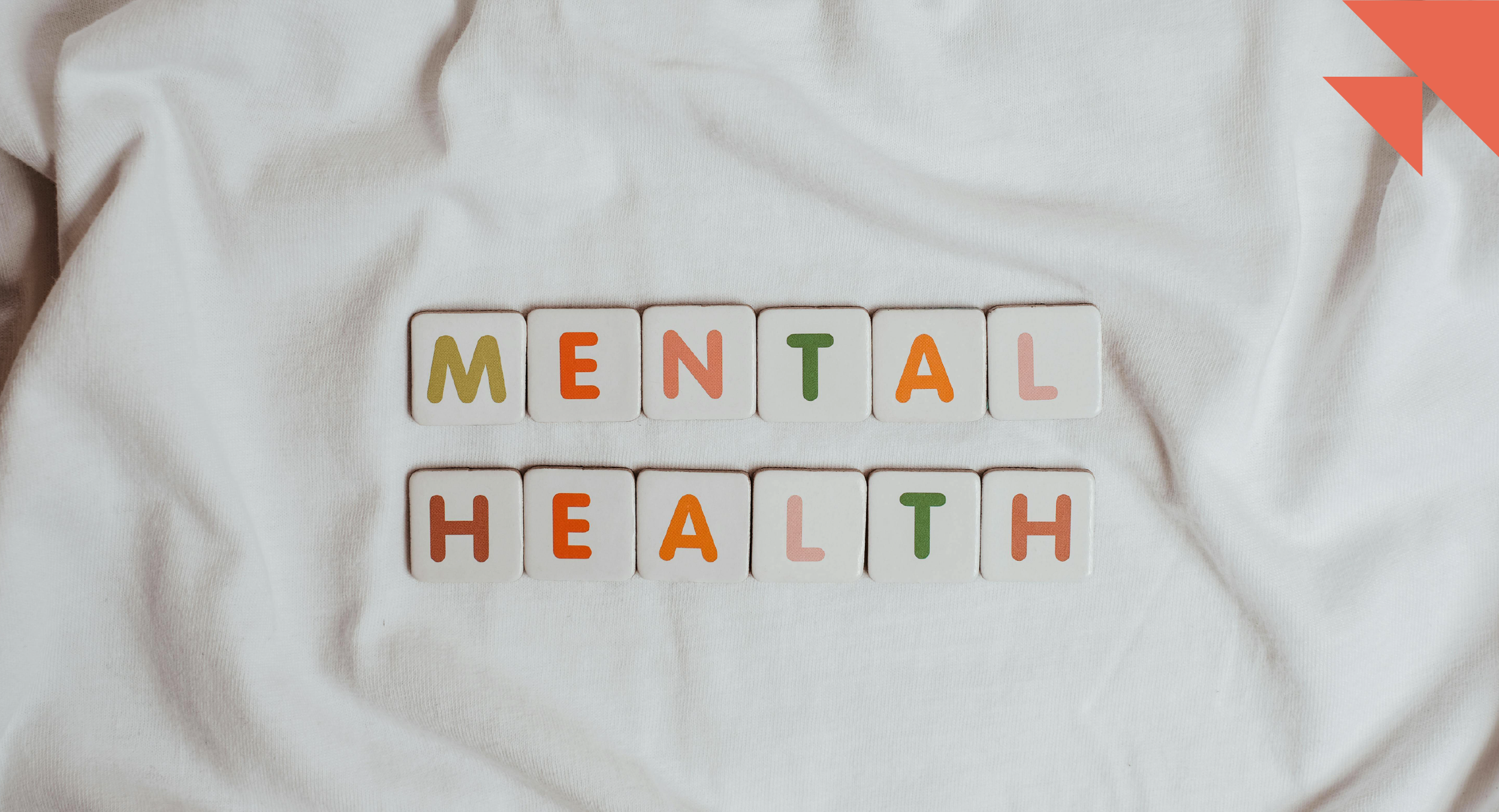 A grouping of letter tiles spells mental health