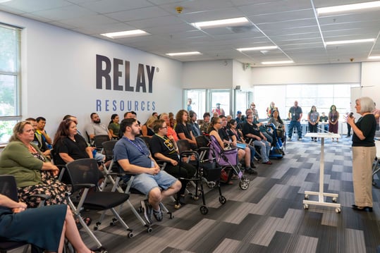 Coleen Carey presents to a room of Relay employees