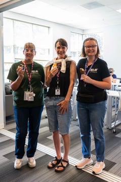 Relay team members eating ice cream at the ADA flag raising and ice cream social