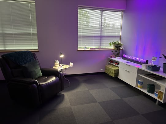 Another angle of Relay's sensory room includes fidget toys,  noise cancelling headphones, and coloring books.