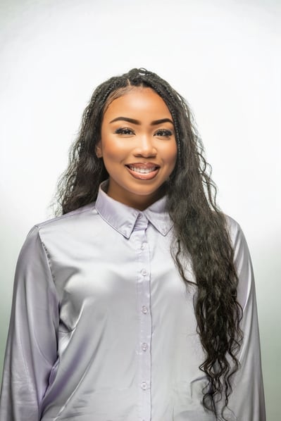 Kymbreanna Elliot a black woman Formal Photo with long black hair  and silver blouse