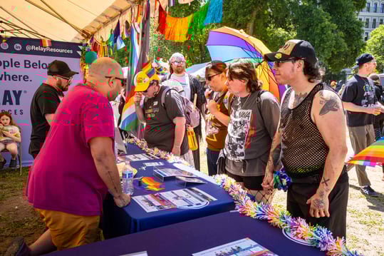 Community members visiting Relay's booth at the Portland Pride Festival