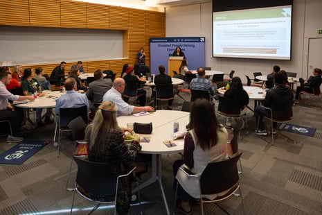 Participants listening to Dr. Jennifer Camota Luebke's presentation at the inclusive workforce training