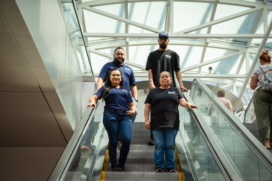 Photo of airport janitors on escalator